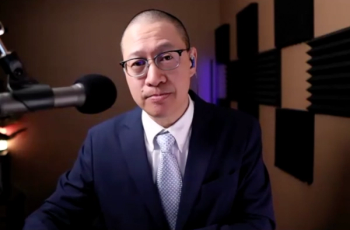 Wayne Kuang, MD, answers a question during a Zoom video interview