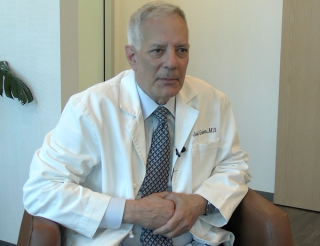Joel Gelman, MD, answers a question during a video interview