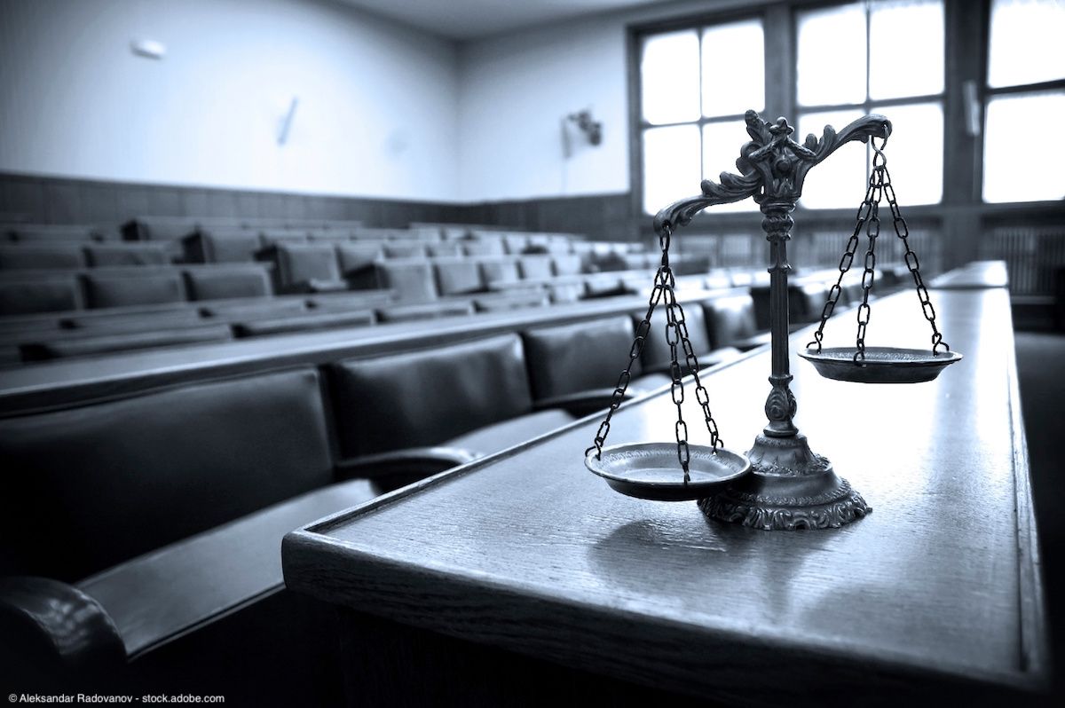 Scales of justice in courtroom | Image Credit: © Aleksandar Radovanov - stock.adobe.com  