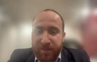 Mohamad Baker Berjaoui, MD, answers a question during a Zoom video interview