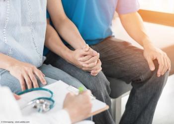 Couple talking with doctor | Image Credit: © Chinnapong - stock.adobe.com 