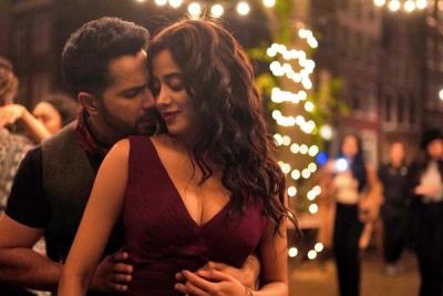 Varun Dhawan and Janhvi Kapoor in a still from Bawaal, on a street hung with string lights at night