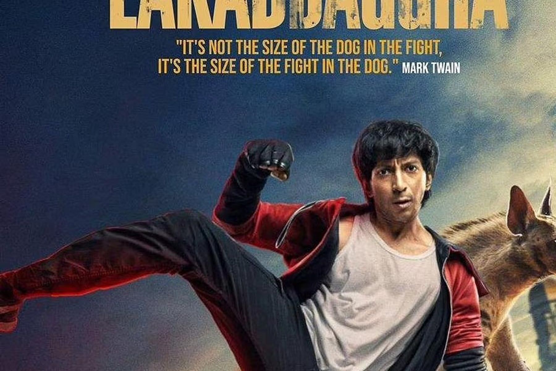 Film poster of a young man mid-kick on the roof of a yellow taxi, with a dog behind him and a red-and-grey title