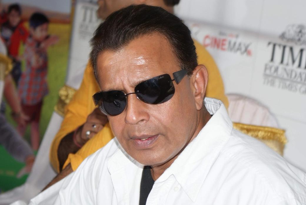 Mithun Chakraborty in sunglasses and a white shirt at an event in Mumbai