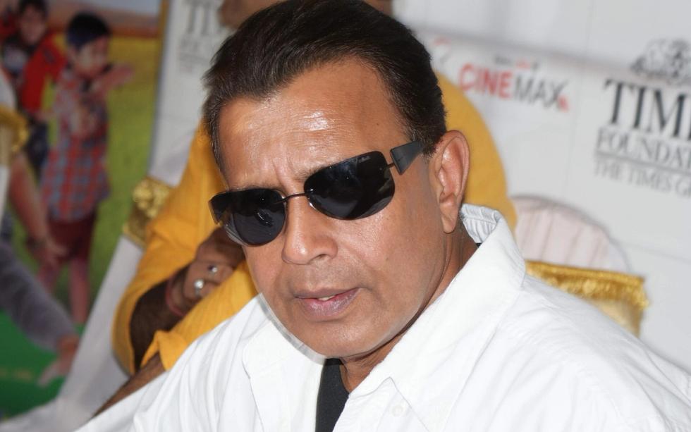 Mithun Chakraborty in sunglasses and a white shirt at an event in Mumbai