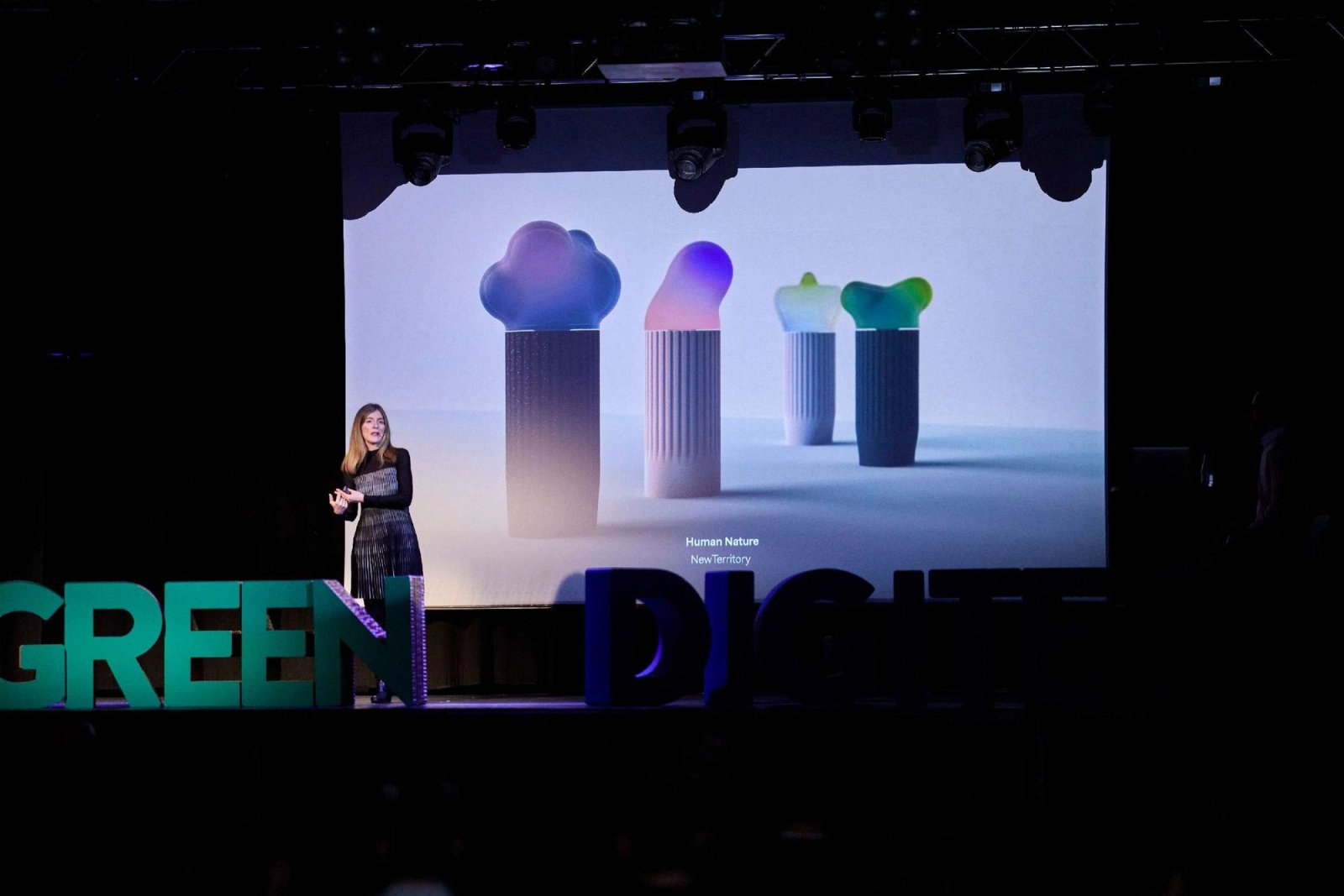 Talk on a stage with a projection