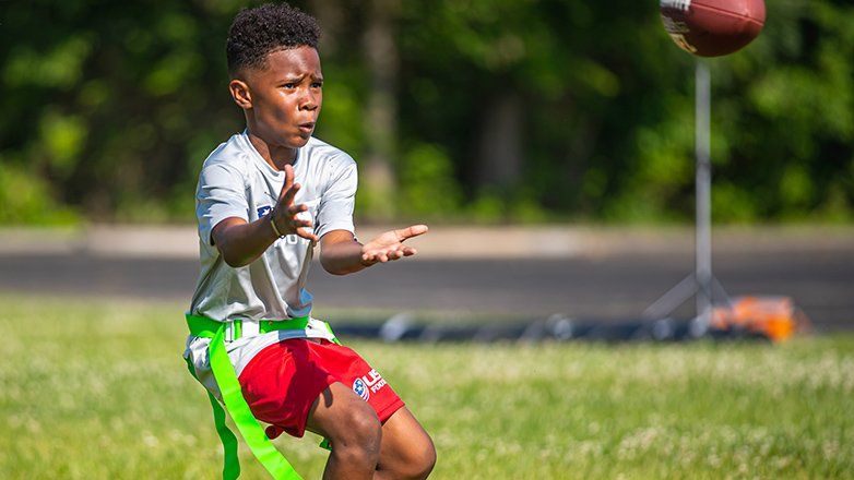 Child catching a football
