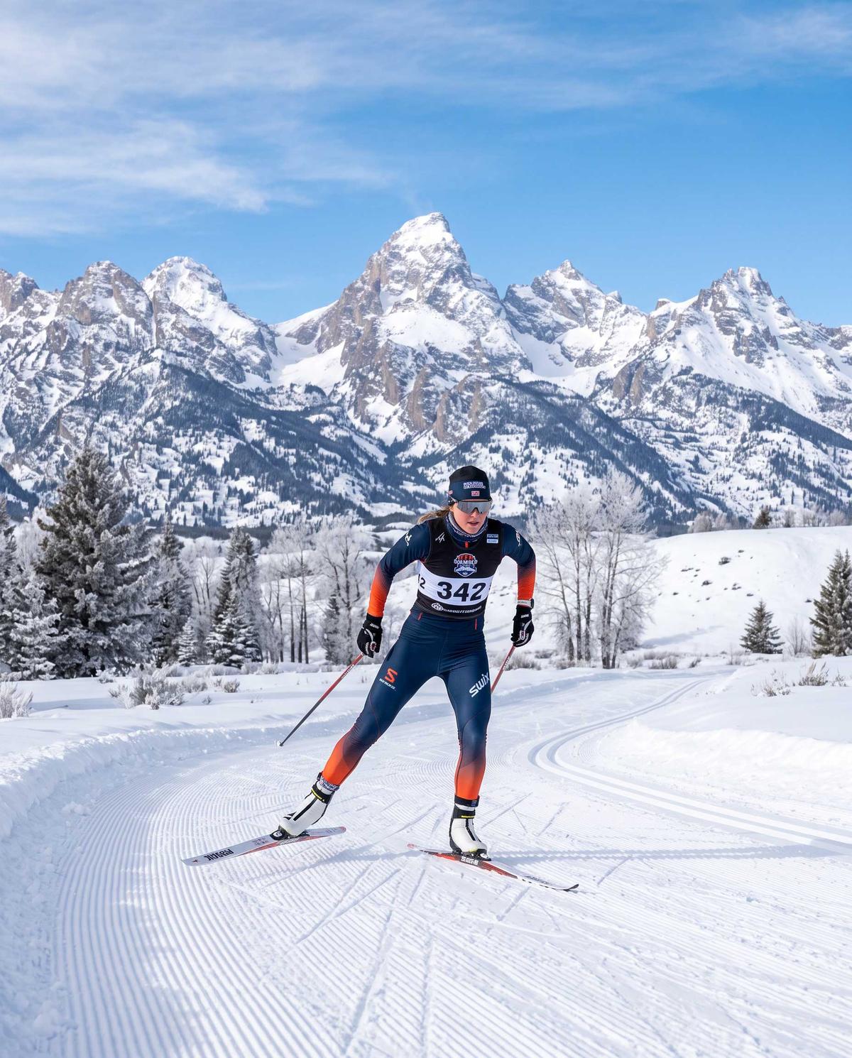 Nordic skate skier on a groomed track below the Teton range