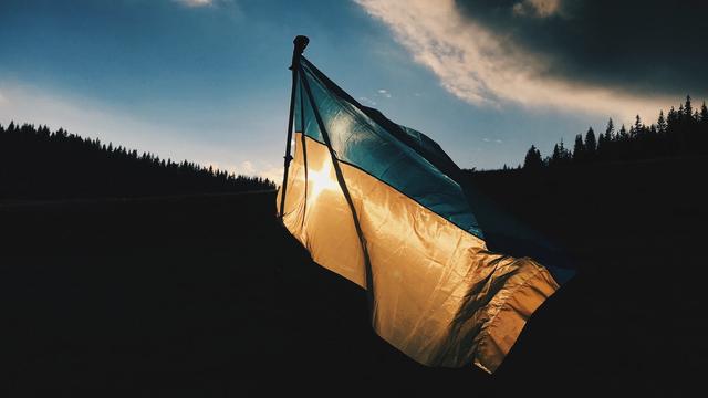 Ukrainian Military Soldier in front of a Ukrainian Flag