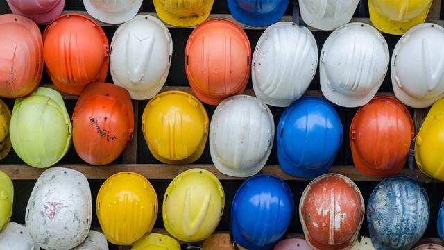 Overhead image of multicolored hardhats