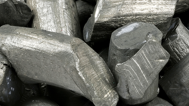 Pieces of lithium, dark gray pieces of metal
