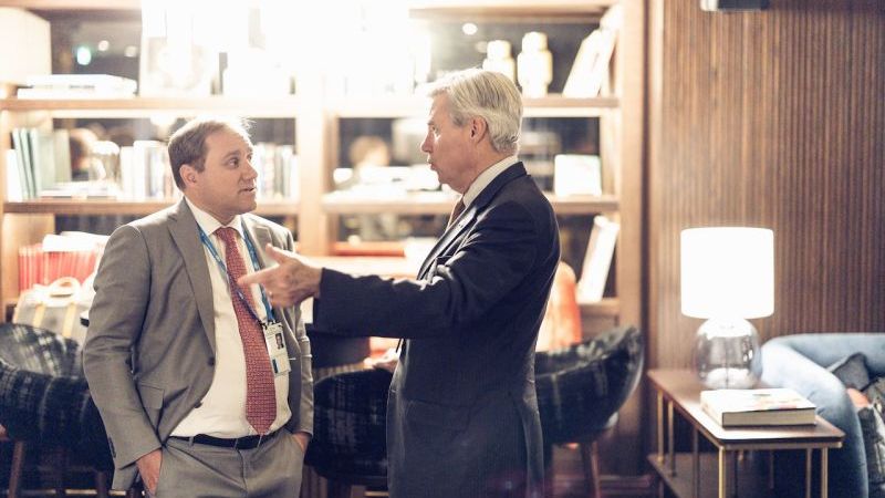 Dimitri Alperovitch talking with an attendee at the reception
