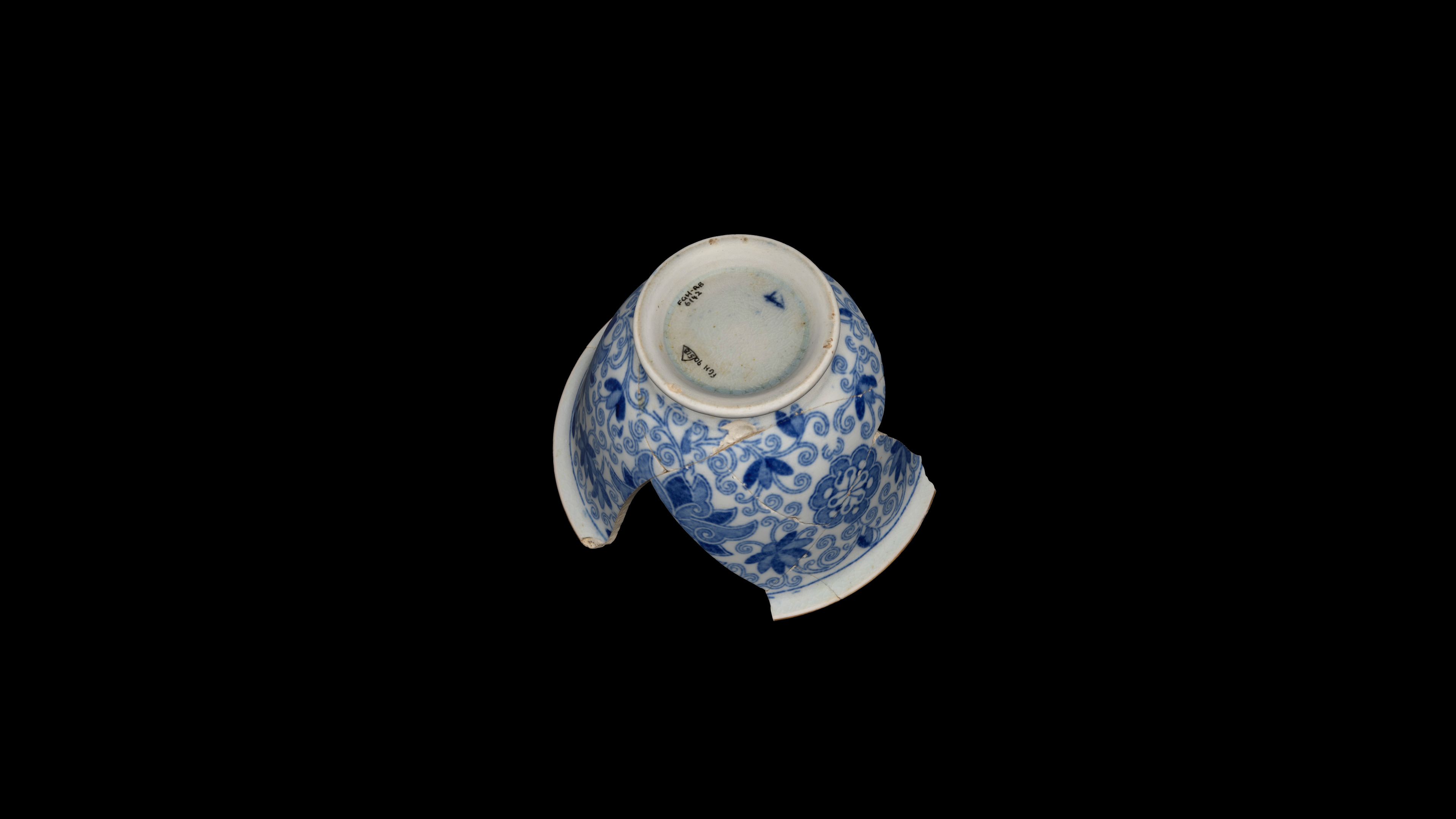 A top-down view of the cup showing its accession number.
