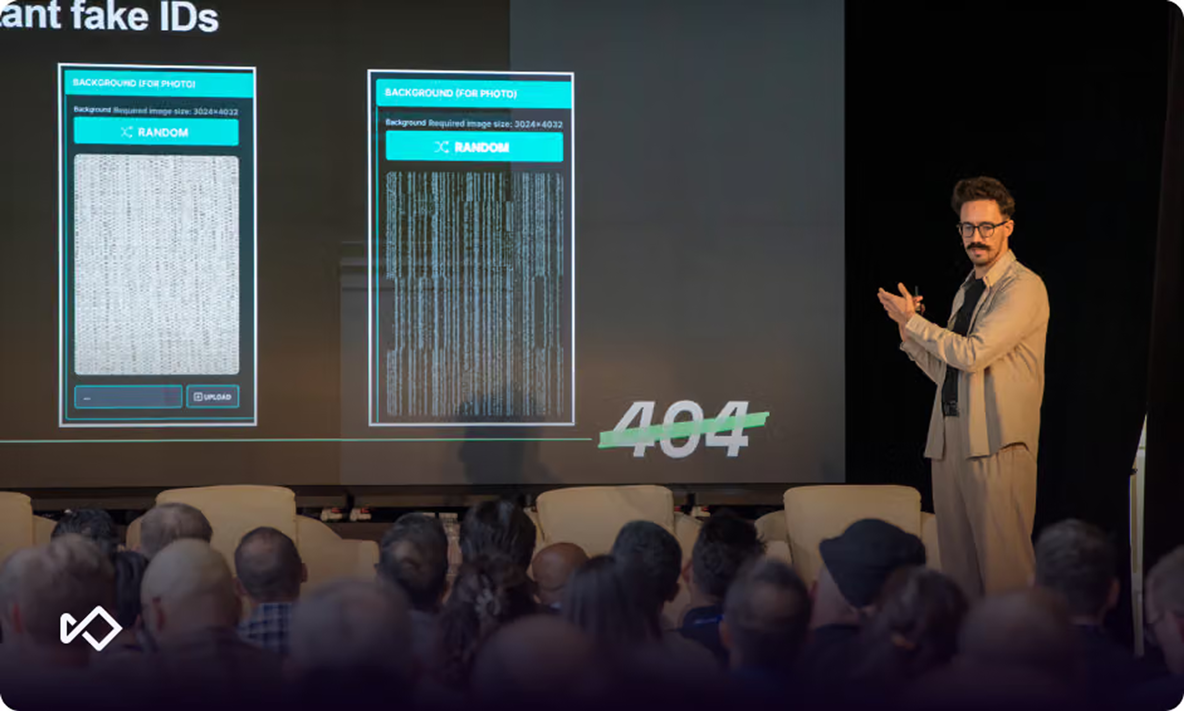 A presenter on stage gestures towards a screen displaying mobile interfaces with fabric and digital static backgrounds, and "404" text, as an audience watches.