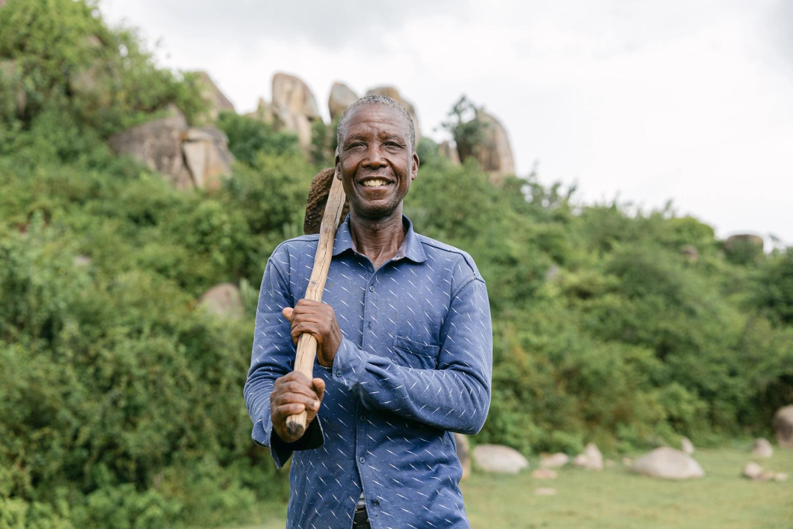 A farmer digging an irrigation channel