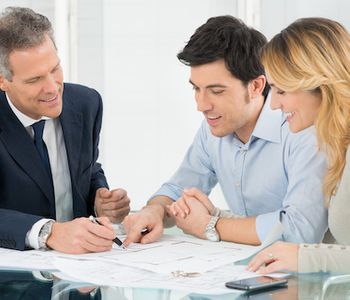 Clients discussing VA Loan with mortgage specialist.