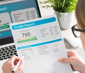Woman looking at credit report.