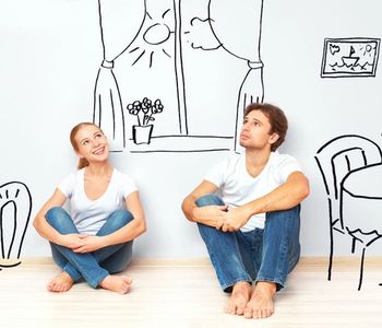 Couple thinking if now is the best time to buy a home.