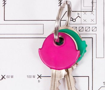 Home keys placed above house plan.