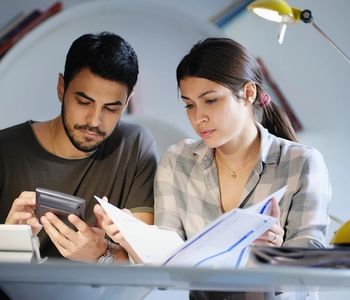 Couple going over home equity loan documents.