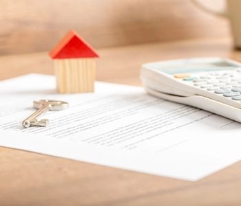 VA Loan documents with key and calculator.