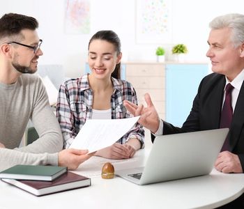 Couple discussing mortgage with a VA lender in Arizona.