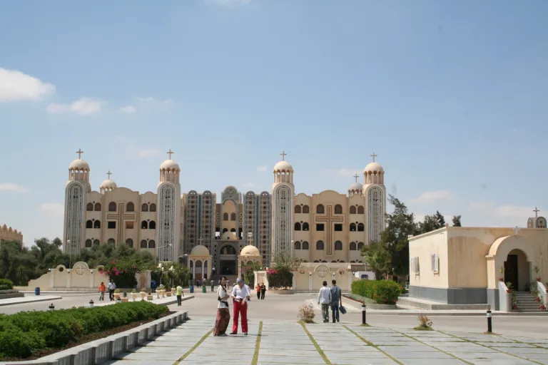 Visitors in the courtyard at the Monastery of Saint Mina.
