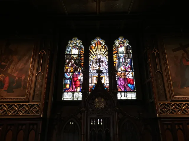 A group of stained-glass windows in Notre-Dame Basilica.