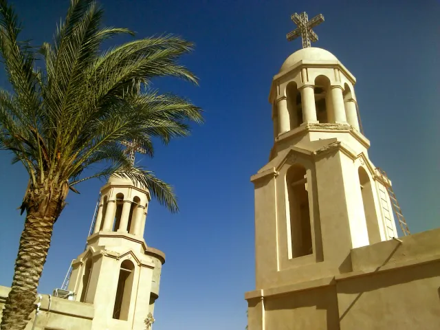 A closer view of cross-topped towers at Baramous Monastery in 2012.