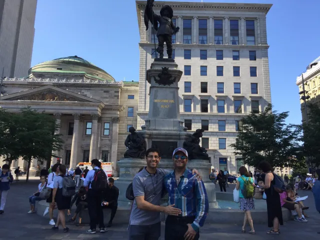 Two travelers in Place d’Armes, Montréal.