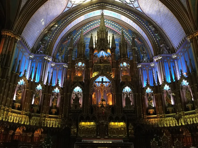The illuminated sanctuary inside Notre-Dame Basilica.