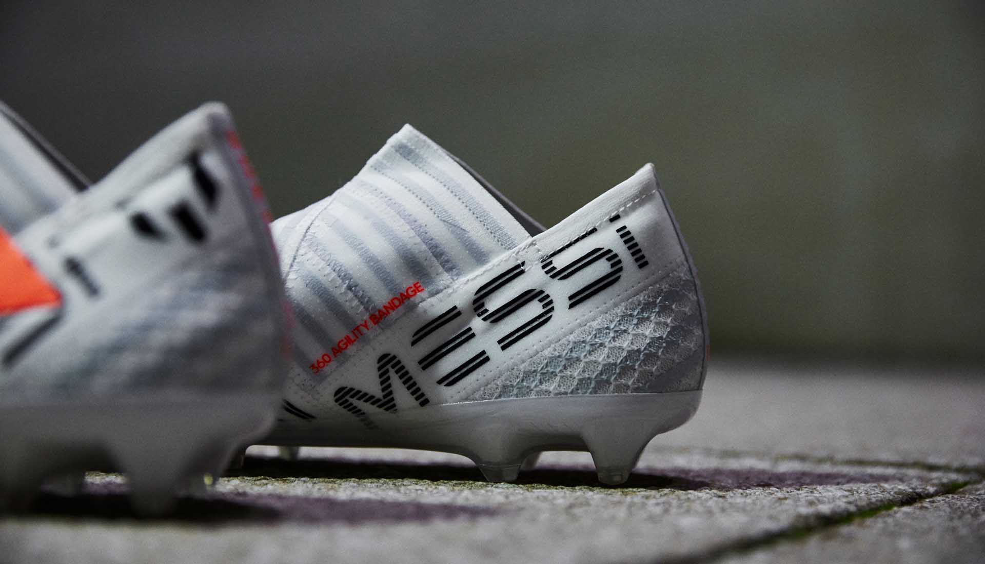 Nemeziz Messi 17+ "Pyro Storm" lateral product shot, White/Solar Orange colorway