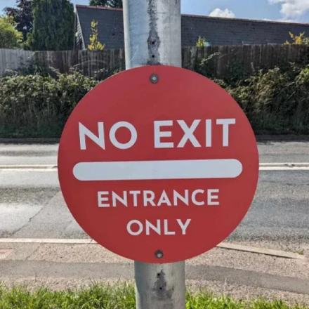 Red 'No exit' sign with bold white text. 