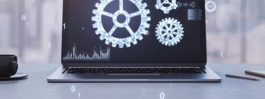 A laptop displaying a dark screen with glowing white outlines of gears, charts, and data, representing website maintenance and technical operations, with binary code numbers floating in the foreground.