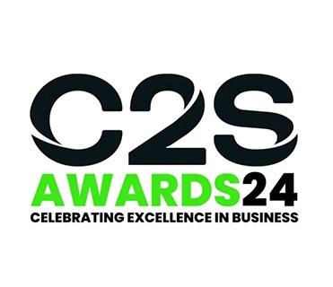 The image displays the logo for the "C2S Awards 2024". The "C2S" is large and black. "AWARDS" is in bright green, and "24" is in black, forming "AWARDS24". Below, in smaller black text, is the tagline "CELEBRATING EXCELLENCE IN BUSINESS". The background is white.