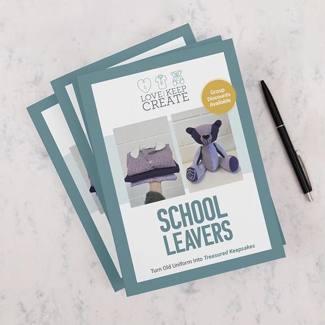 Stack of brochures with a pen.