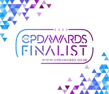 The image is a white graphic with the "The CPD Awards Finalist 2023" logo. The text is stylized with a gradient from blue to purple, enclosed by a thin outline, and includes the website "WWW.CPDAWARDS.CO.UK" at the bottom. The top-left and bottom-right corners are decorated with triangular patterns in shades of blue, purple, and white.