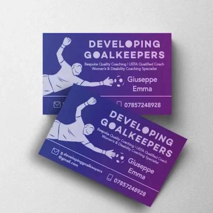 Blue and purple business cards, with 'developing goalkeeping' branding.