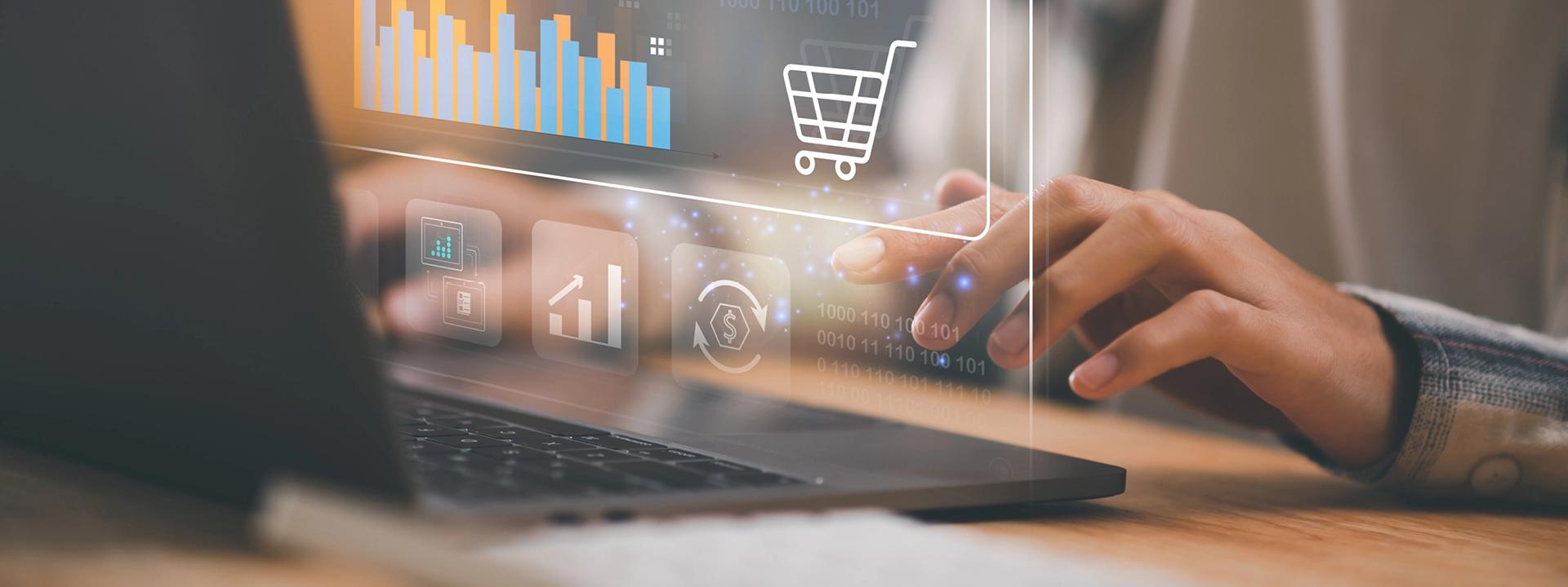 A person is typing on a laptop with a transparent overlay showing a shopping cart icon, bar graphs, and other digital icons, symbolising e-commerce development and online business growth.
