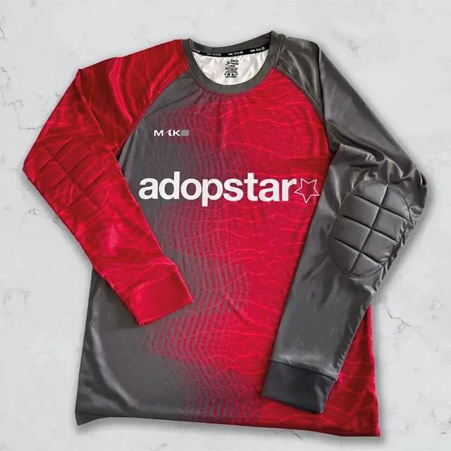 Long sleeved red and grey football shirt.