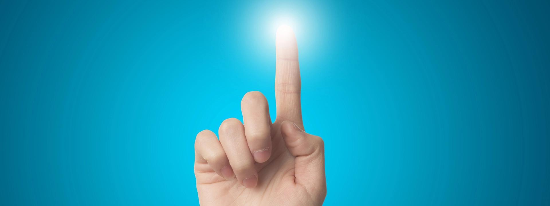 A hand with an index finger extended upwards, pointing towards a bright, glowing light against a vibrant blue background, symbolising interaction, activation, or reaching a goal in Meta PPC advertising