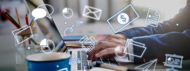  A person is typing on a laptop, with numerous white digital icons representing business and communication concepts (such as chat bubbles, pie charts, envelopes, money, documents, folders, handshakes, and presentations) floating around the keyboard. This visually represents affiliate marketing activities.