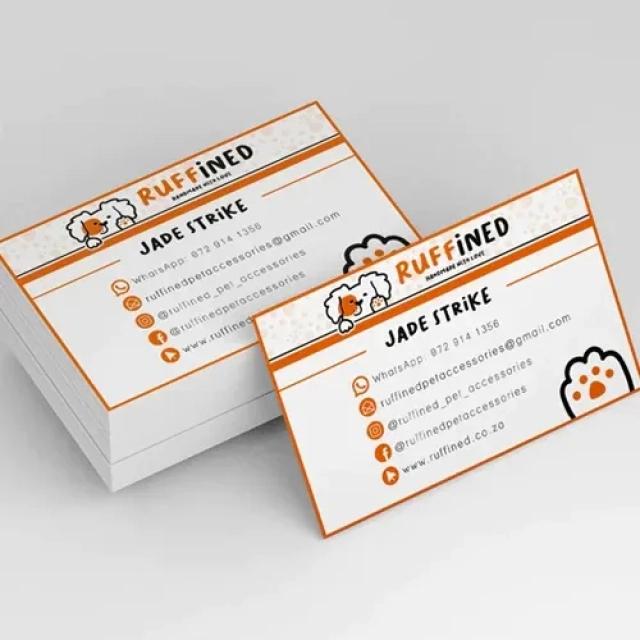 White business cards with black text and orange trim. 