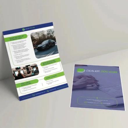 Two flyers for "DEALER DOC.COM" are displayed. The upright flyer, primarily white with blue and green accents, features images of a car and people working, highlighting business benefits. The flat-lying flyer has a blue tone, showing hands on a keyboard and presenting contact information.