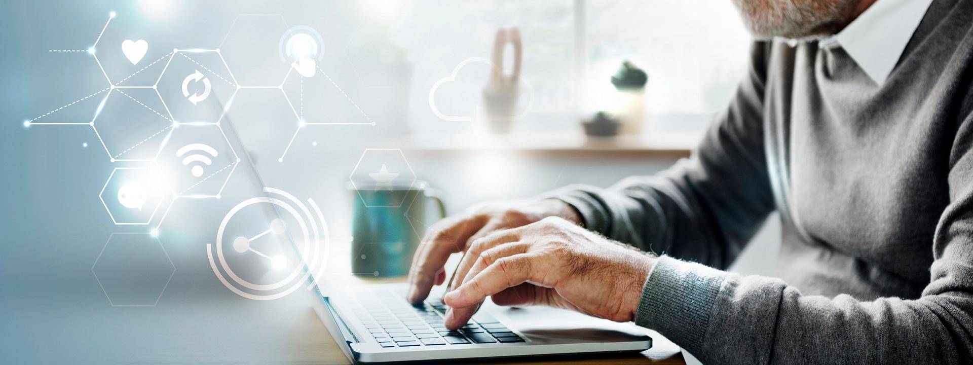 A person is typing on a laptop, with a digital overlay of interconnected icons like a heart, refresh symbol, WiFi signal, and cloud, symbolising e-commerce SEO and online connectivity.