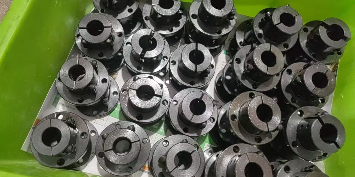 Two silver CNC-machined aluminum pipe clamps securely fastened to a galvanized steel tube, representing a structural frame assembly.