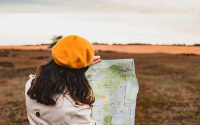 women with a map looking where to go