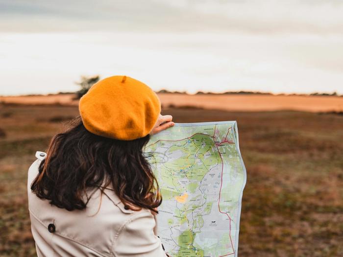 women with a map looking where to go