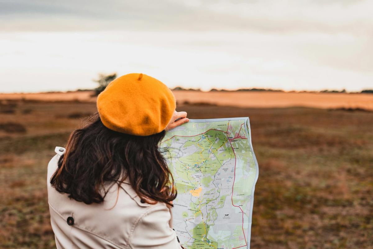 women with a map looking where to go