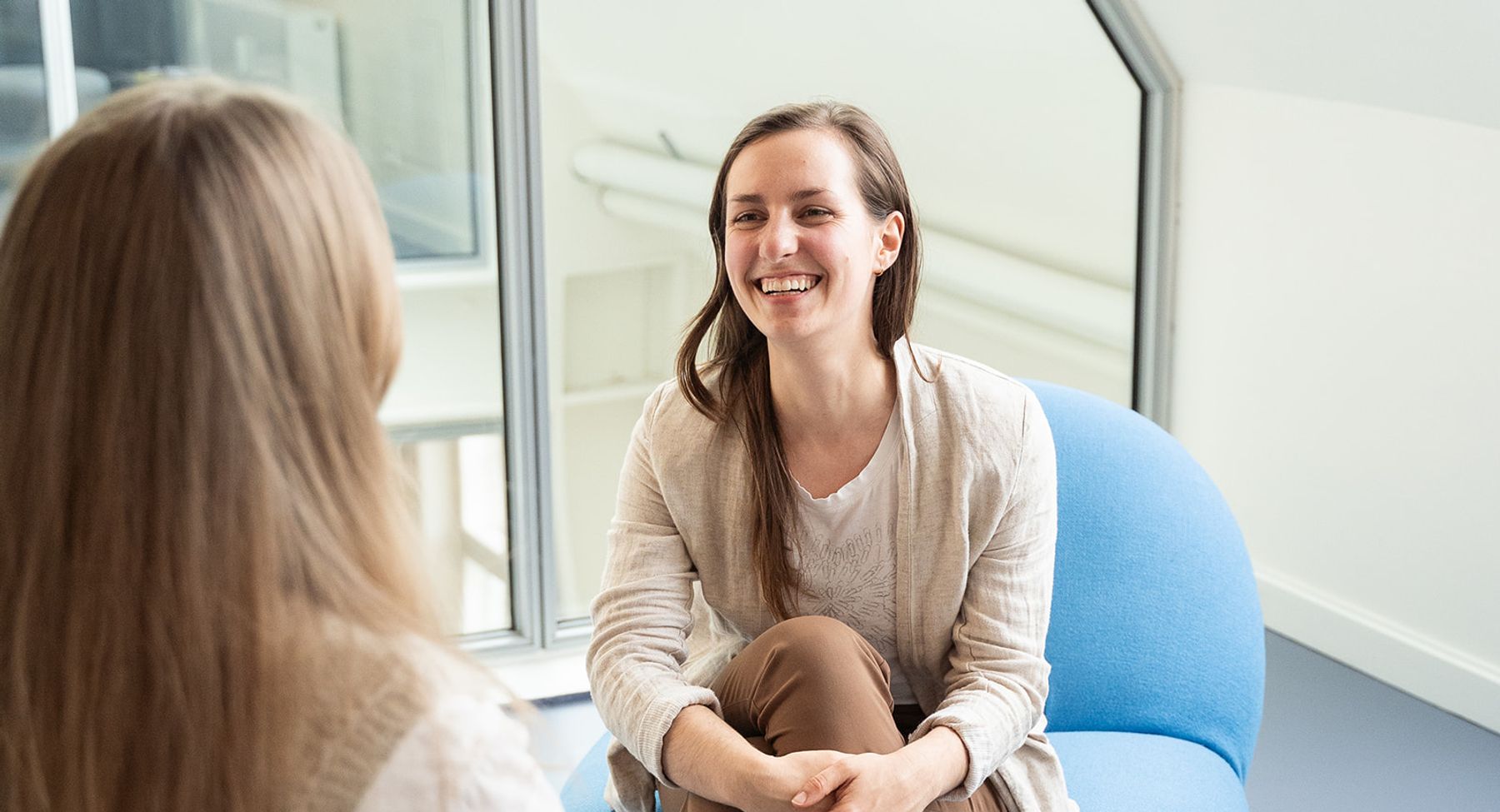 Maja Herrero facilitating integrative women's health session with women, warm natural light 